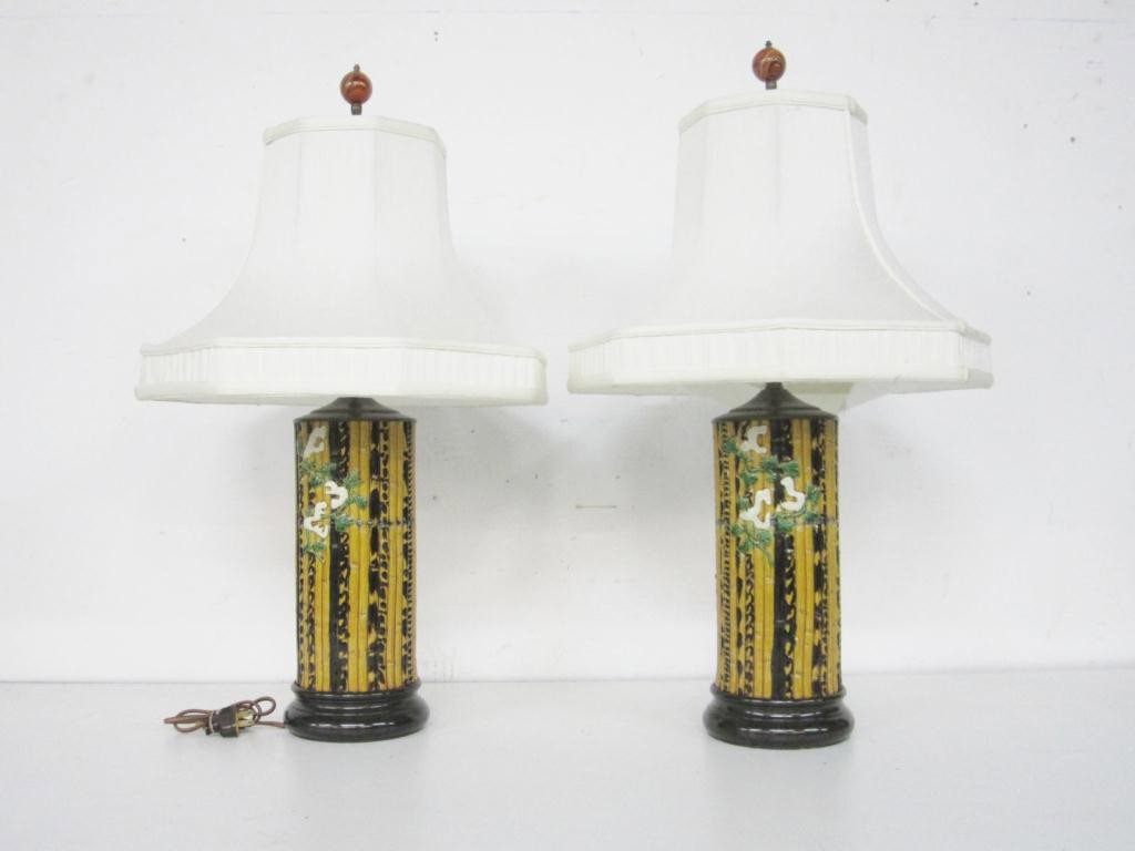 Pair "Feng Shui" Faux Bamboo Lamps: each with a floral design among varying toned faux bamboo shoots. Carnelian finials. 27" total.
