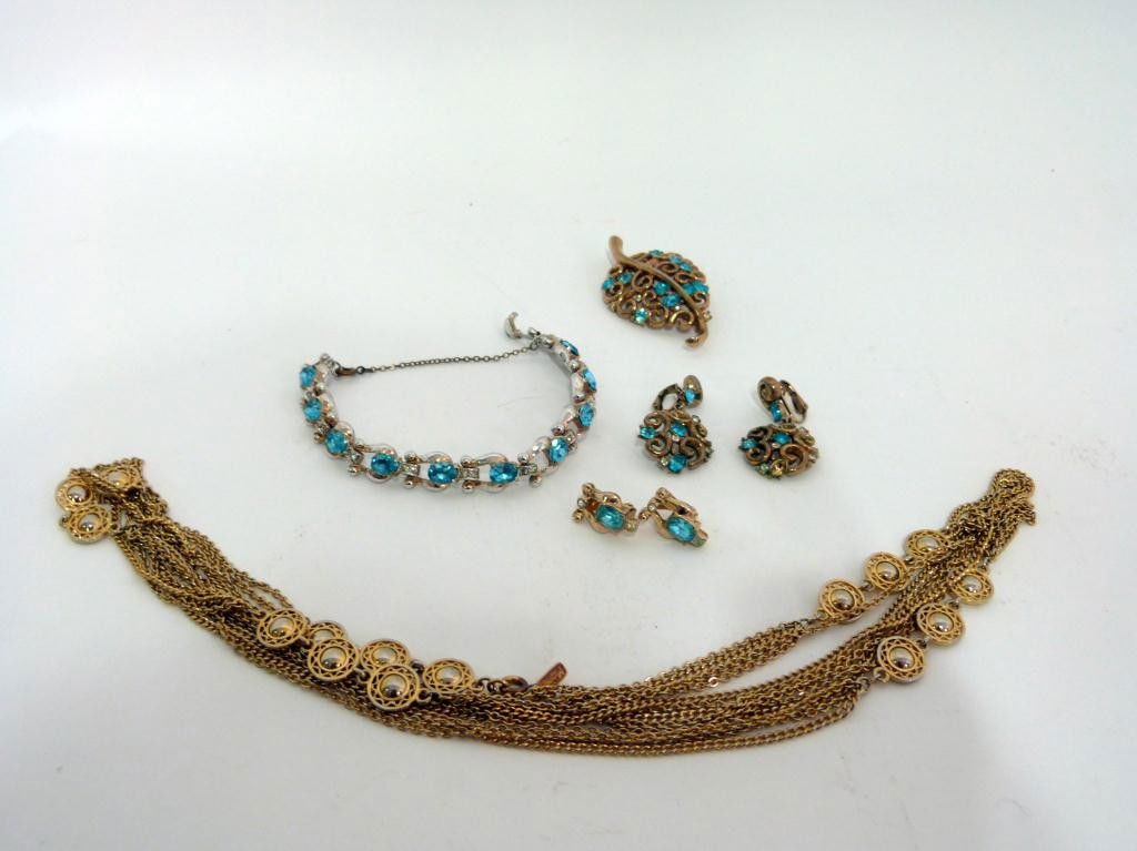 Group of Costume Jewelry - Trifari etc.: 3 piece Trifari Brooch set with pale blue stones, 3 piece set with bracelet and pair earrings, and Monet necklace.