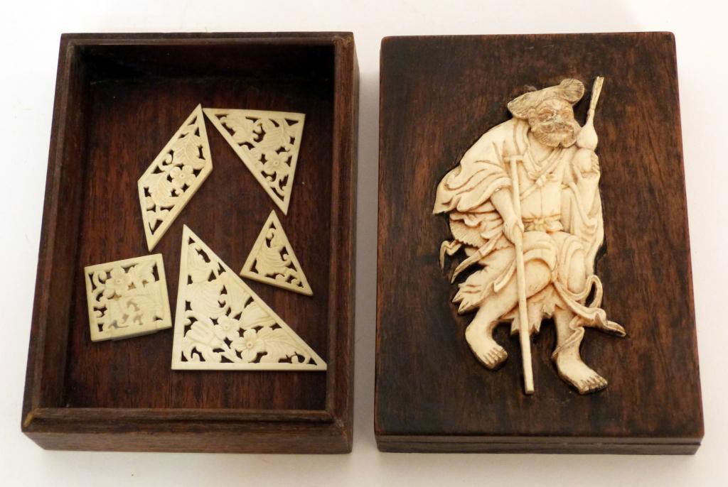 Chinese Ivory Mounted Box and 5 Ivory Shapes: Ivory figural mount on wooden box. 5 Openwork carved ivory shapes for puzzle playing.