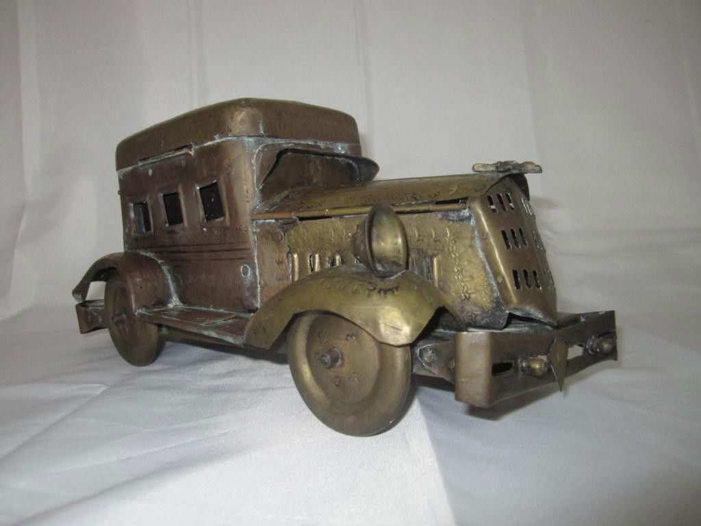 Indian Brass "Paan Daan" Rolls Royce Model: a Paan Daan is a Paan (delicacy) trolley used to serve one by one, a dinner party at a table in a whimsical and festive manner. One would wait for the trolley to "pull up" to them and lift the top and