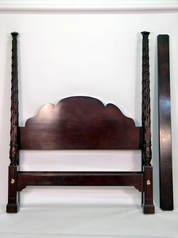 Georgian Style Full Size 4 Poster Canopy Bed: Retailed by Scully and Scully. Vine carved wrapped and valance top posts with urn finials over a silk draped canopy. 7" tall X 65 X 86 overall.