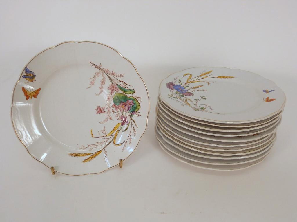 Set 12 Longchamp Terre De Fer Dinner Plates: Each one in a different floral and inset pattern, hand painted. (Impressed Name of Longchamp Terre De Fer)