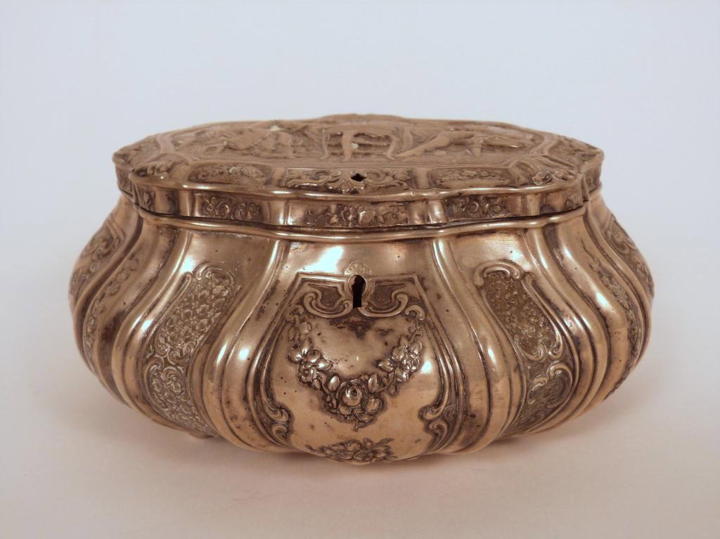 Continental Silver Hinged Top Box: Repousse figural dinner scene cover. .800 mark with a potted flower and GG mark. 7 3/4W X 3 1/4 tall. 8 East 83rd Street Estate (19 troy oz.)