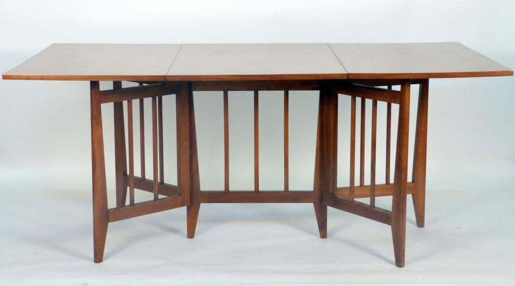 John Stuart Drop Leaf Dining Table: swing out spindle legs and spindle base. 38D X 25W X 29 tall (70W Open) 8 East 83rd Street Estate