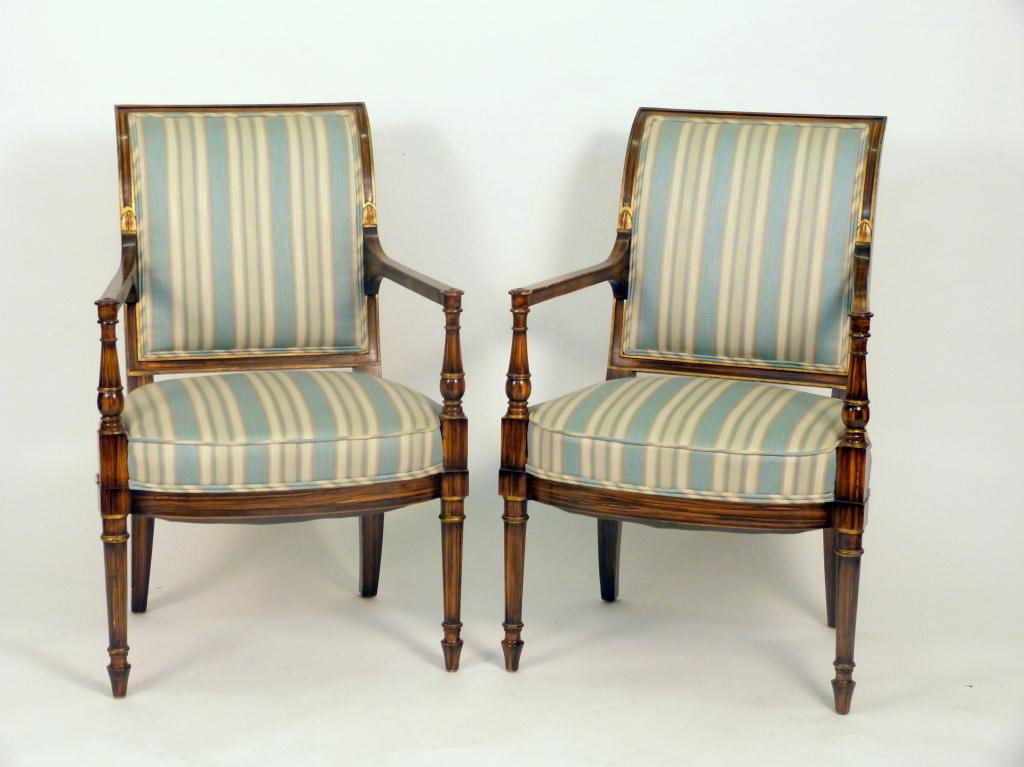 Pair Sheraton Style Open Arm Chairs: Gilt accents on a Grained" finish, upholstered. Very good quality. * Grained = faux wood grain - The process of painting wood to give a rich, detailed wood grain appearance. 425 East 58 Street Estate"