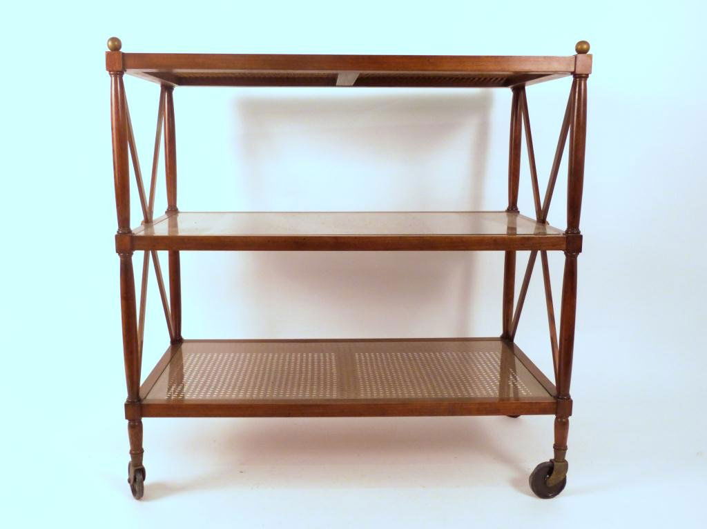 Regency Style 3 Tier Serving Cart: 3 caned tiers, lower 2 with glass. One wheel missing. 18 X 34 X 35 tall.