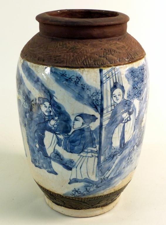 Chinese Porcelain Vase: Painted in blue and white figure decorations within two unglazed brown bands. 8 D x 13" H"