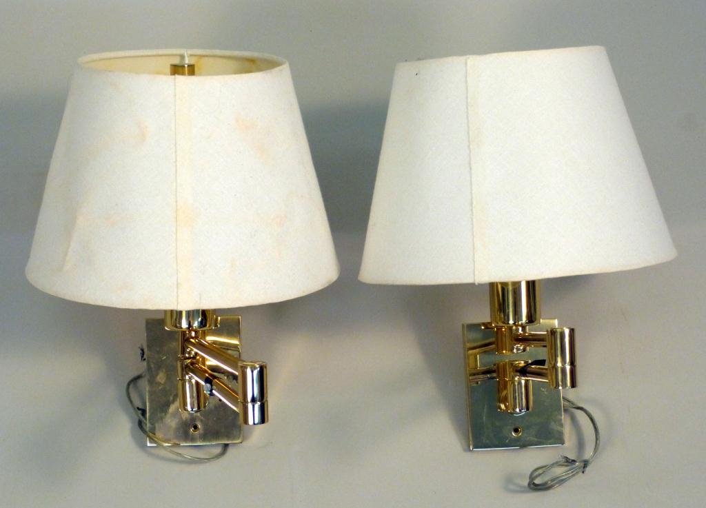 Pair Brass Hansen Swing Arm Sconces: designed by George Hansen, made in spain.