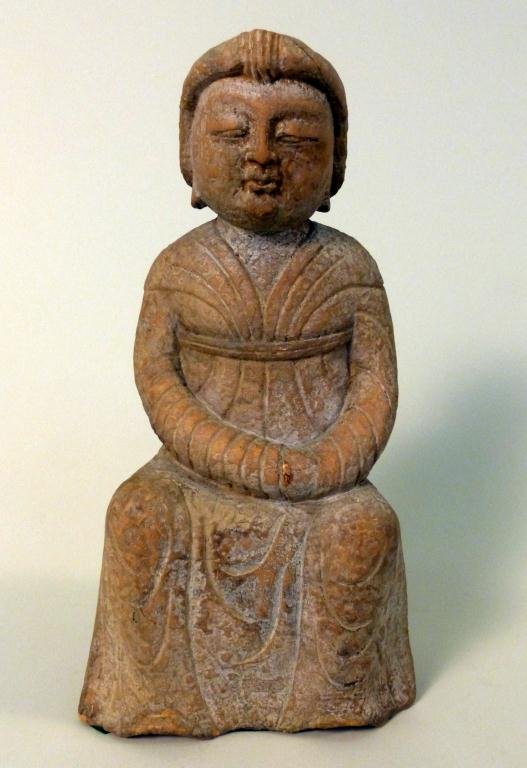Chinese Stone Sculpture: Carved stone sculpture of a Buddhist lady in a long gown seated on a drum shaped stool. 11 1/4H."