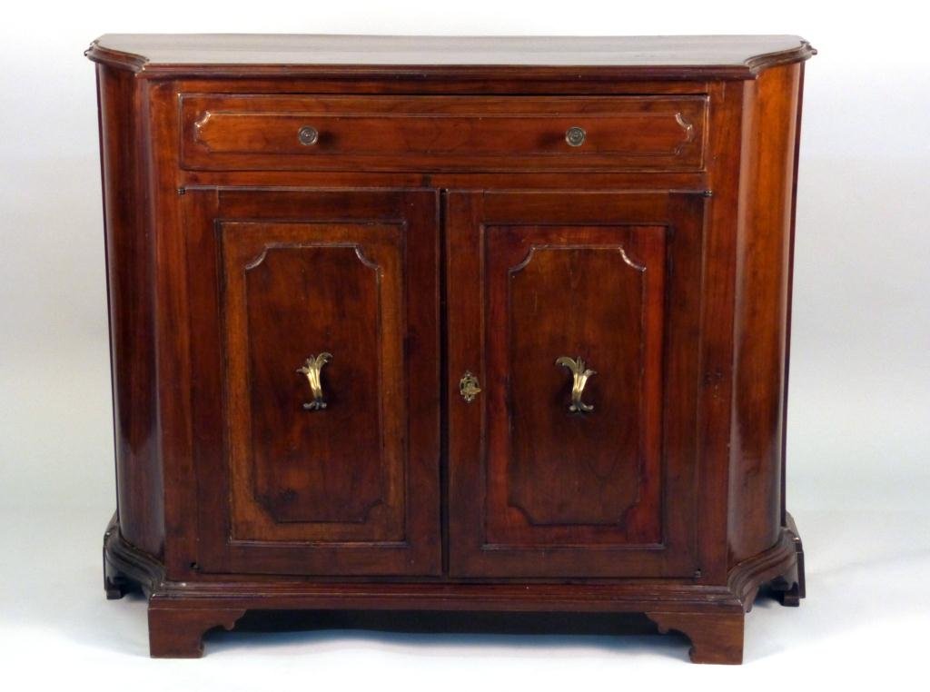 Antique Italian Credenza: Walnut carved inset panel double door fronts with top drawer. Late 18th to early 19th century. Brass pulls and key. 48W x16"D x 39"H"