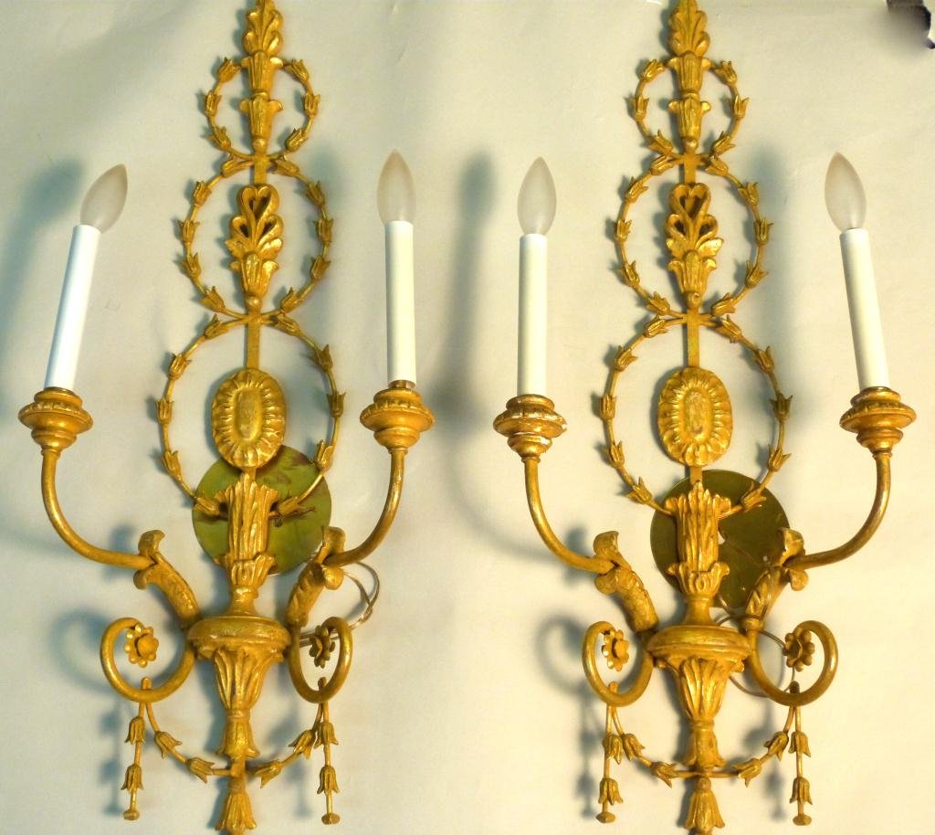 Pair Adam Style 2 Arm Sconces: Pair of Gilt Metal framed and gilt carved wood and Composite two light sconces made in Italy. 31H x 13 1/2" W"