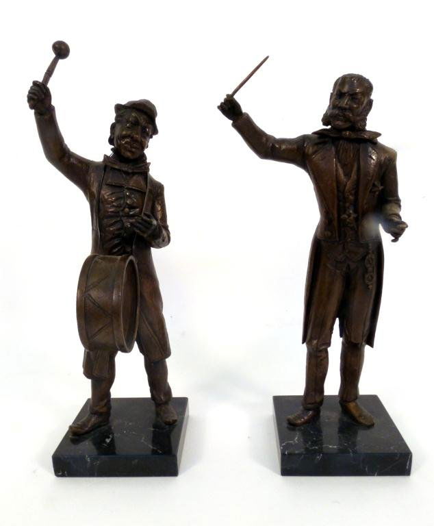 Pair Bronze Musicians: Bronze figural statues, one of a drummer, the other of a conductor. Both mounted on black marble plinths.15H"