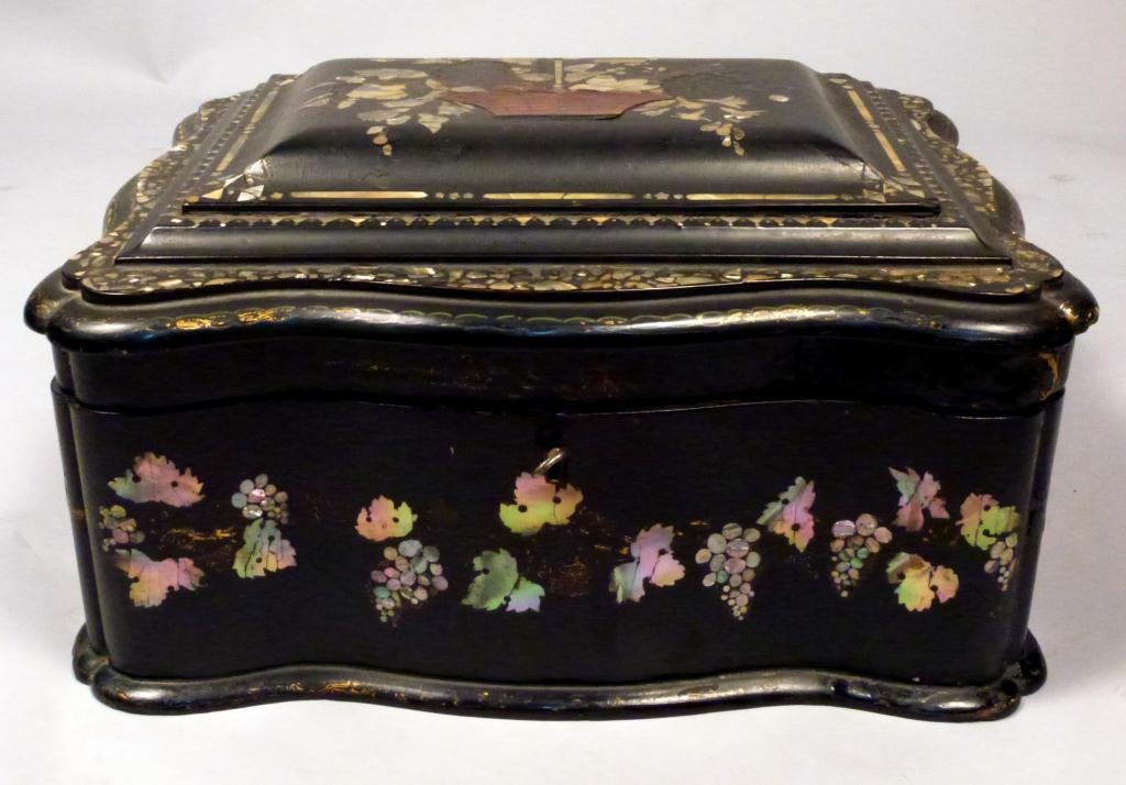 French Victorian Table Top Jewelry Chest: With Mother of Pearl inlay. with basket of flowers design inlaid top, 2 lined removable trays, all over desings on papier mache frame. 17W x 14"D x 10"H"