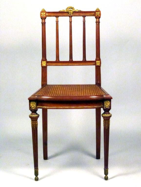 French Bronze Mounted Side Chair: Caned walnut with finely detailed bronze mounts. 17W x 14 1/2"D x 34"H"