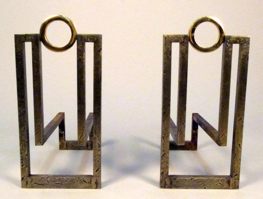 Pair Art Deco Mixed Metal Andirons: Manner of Karl Springer. Wrought iron with brass rings. 11 1/2L x 6 3/4"W x 14"H"