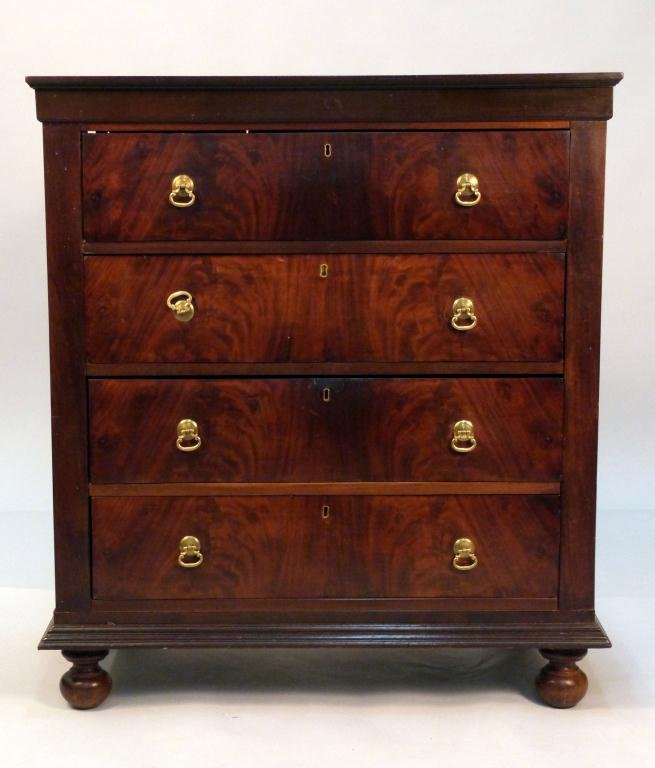 Antique American Empire 4 Drawer Chest: Brass hardware, molded cornice and base, on ball feet. 34L x 17 1/2"D x 38 1/2"H"