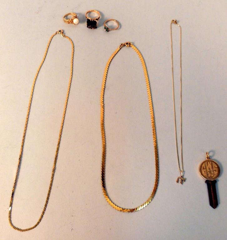 Gold Jewelry Lot: Including 2 - 14K chains (one with Chai) , 18K chain, 3 18K rings (one with pearl), and a 18K key holder.