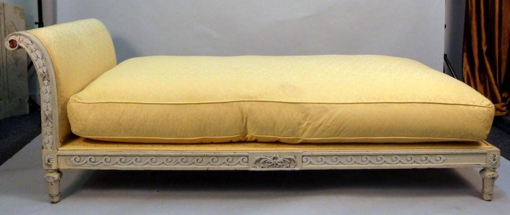 Louis XVI Style French Chaise / Daybed: Carved and painted and Caned back on reverse. With upholstered cushion. 84L x 36"W x 29 1/2"H"
