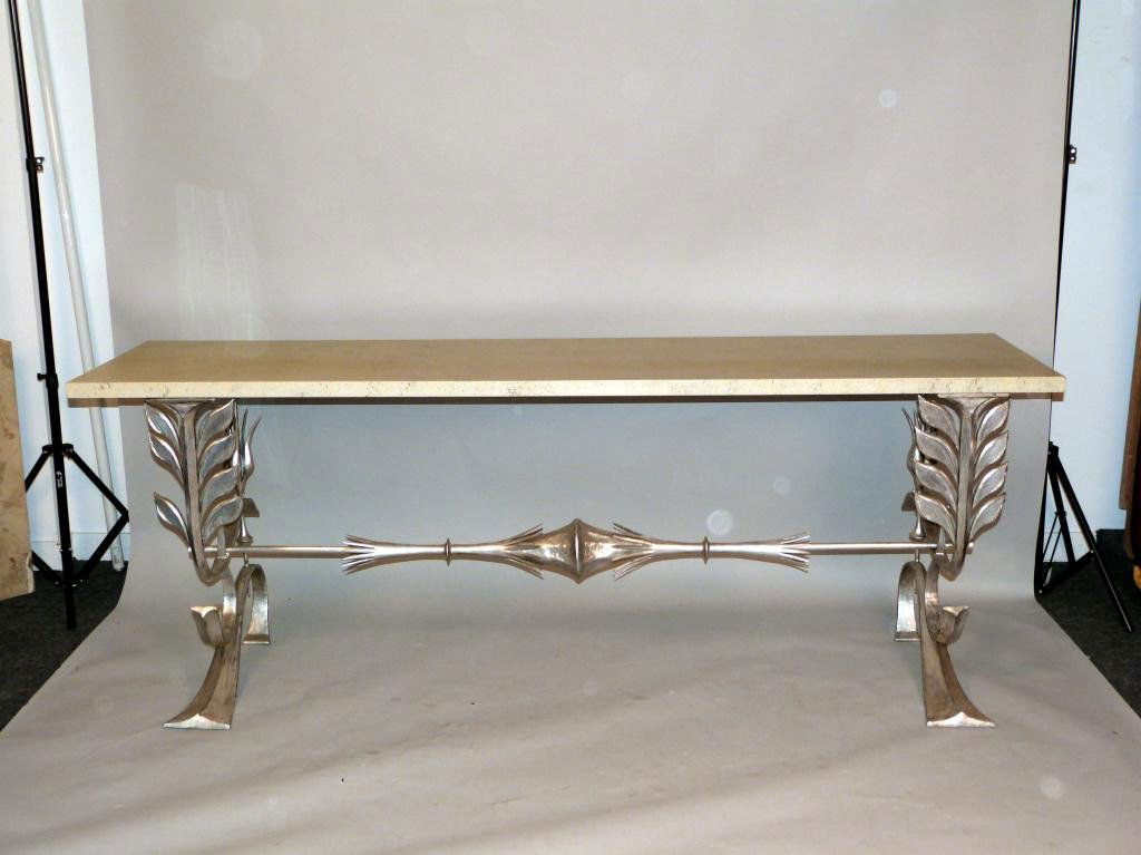 Modernist Thomas Britt Silvered Console: Painted faux travertine top and silvered metal base. 90L x 26"D x 33 1/2"H"