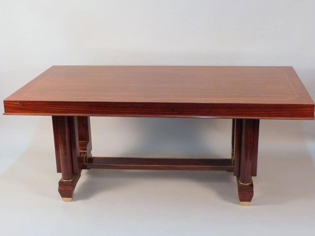 Art Deco Dining Table - After Jules Leleu: Geometric line inlay top, sculpted brass mounted and trimmed base. 71L x 35 1/2"W x 30"H"