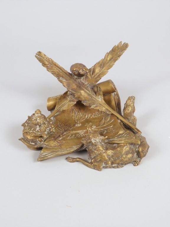 J. Moigniez Signed Bronze Figural Inkwell: Jules Moigniez (French, 1835-1894), bronze inkwell with wolf and bird decoration, inscribed ''Fables de La Fontaine'', signed ''J. Moigniez'', 5'' h., 8'' w. - Missing glass cover. (Kew Gardens Estate