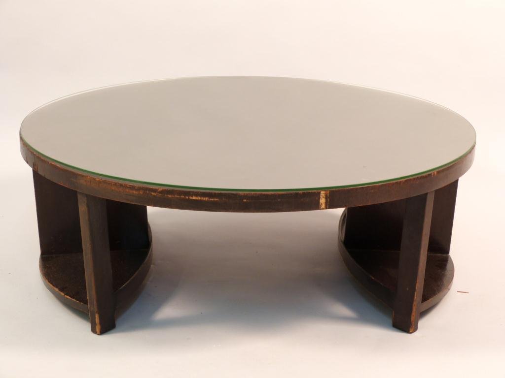 Art Deco Round Cocktail Table: Each ovoid shape leg with a 2nd tier. 40Dia x 14 1/2"H Protective glass top. (Estate of a 114 Year old Woman -180 West End Avenue)"