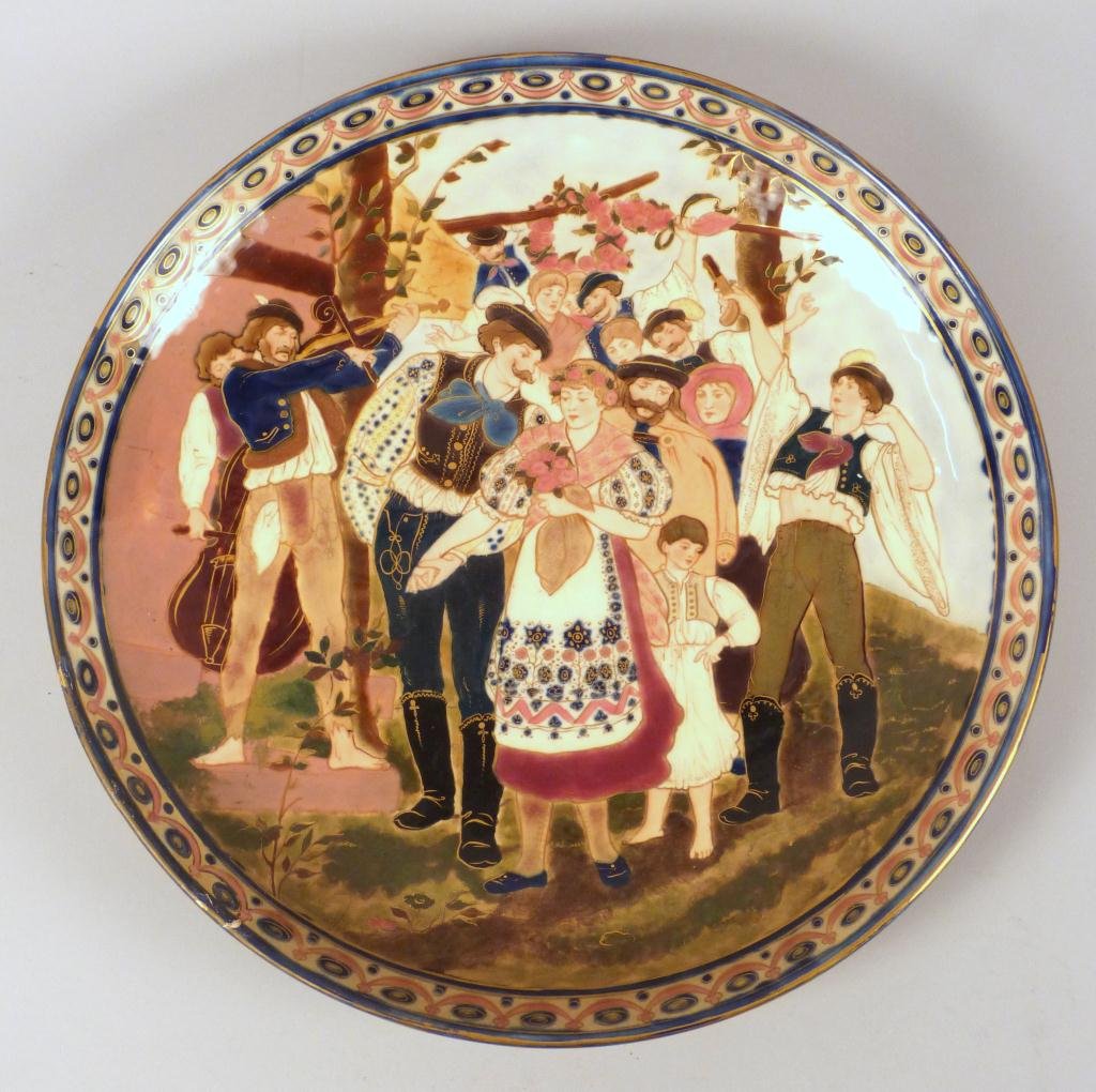 Zsolnay Glazed Ceramic Charger: As is, Crack across middle with large repaired chip on edge. Stamped made in Austria - Hungaria. 15"D (535 East 86 Street Estate)