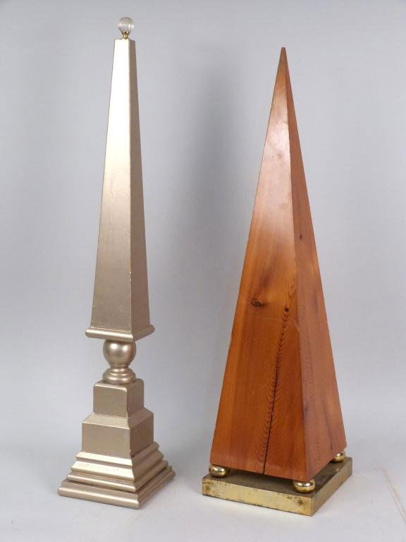 2 Wood Obelisks: One painted with glass finial 33H. One brass plated base. Age crack 31"H"