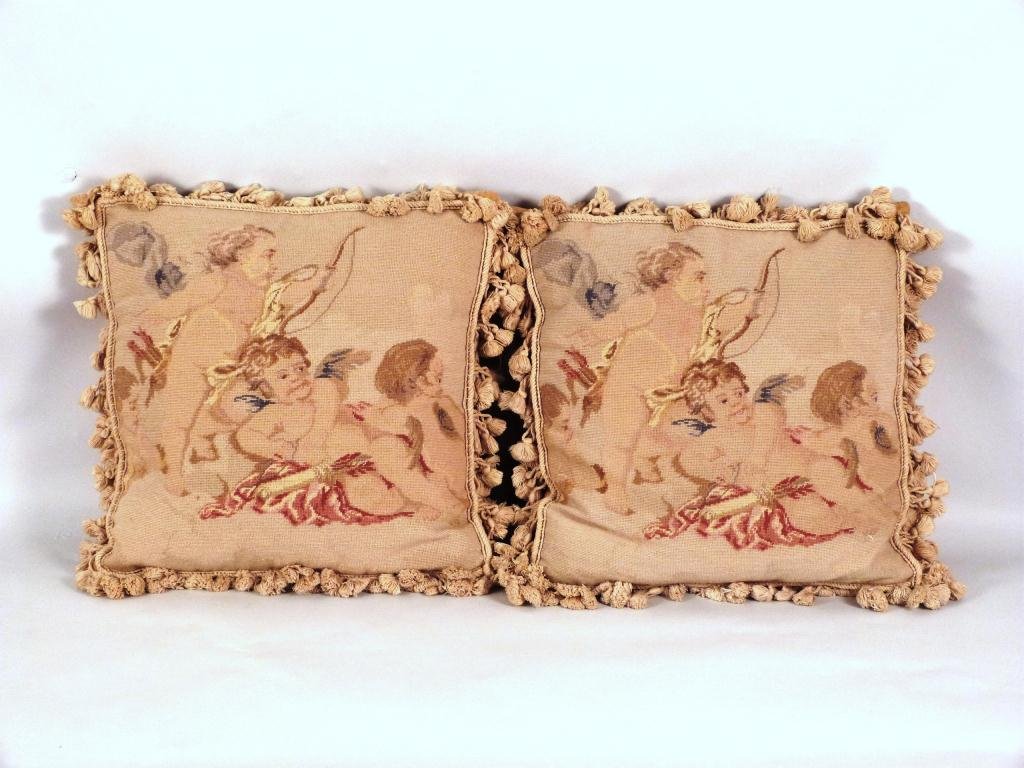 Pair of Needlepoint Pillows: Cupid's, with tassels. 16 square"