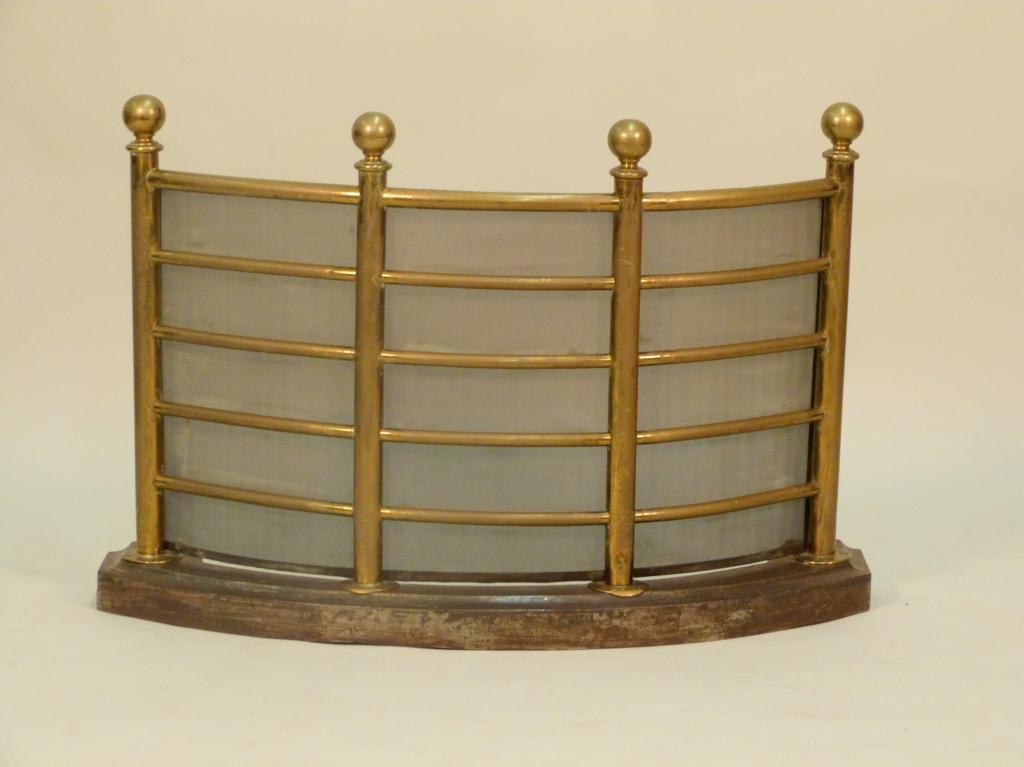 Antique English Brass Fire Fender: Demi-lune shape with cast iron base and 4 ball finials. Screen backed. 35W X 11"D X 23"tall."