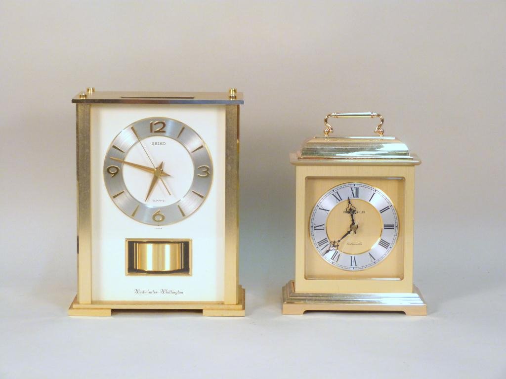 2 Brass Plated Mantle Clocks: Seiko and Howard Miller. Taller is 9 H. (Estate of Peter Jennings)"
