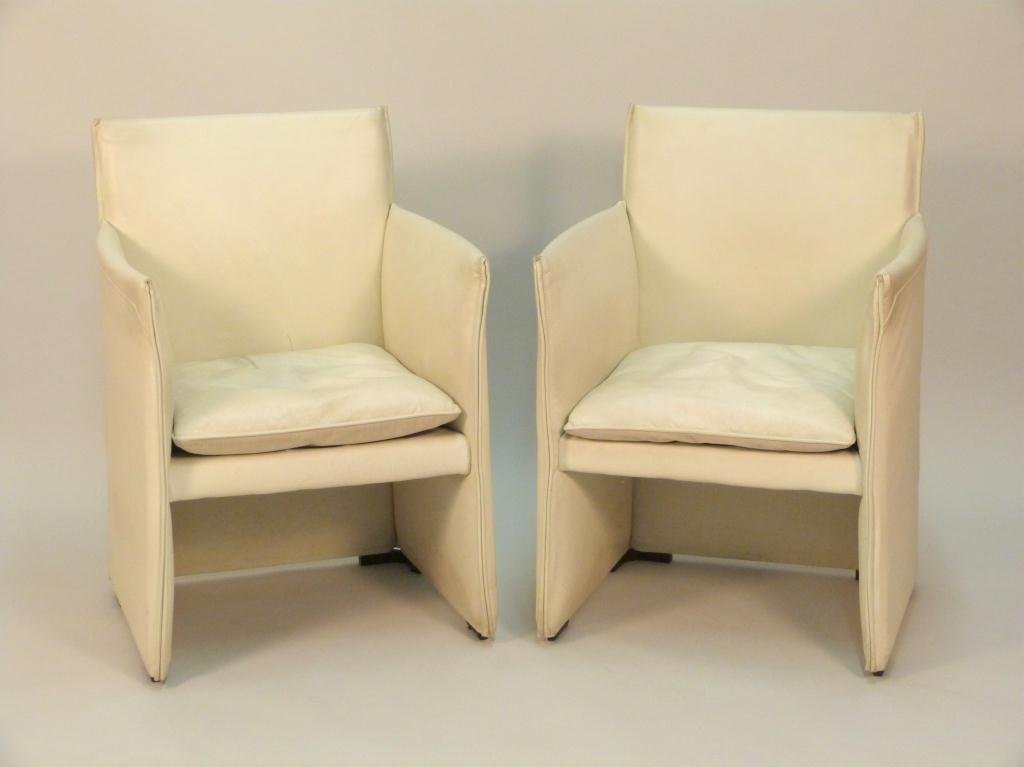 Pair of Italian Style Leather Arm Chairs: Worn. Ebonized wood feet. After Sappariti. 22 1/2W X 22"D X 33 1/2"H"