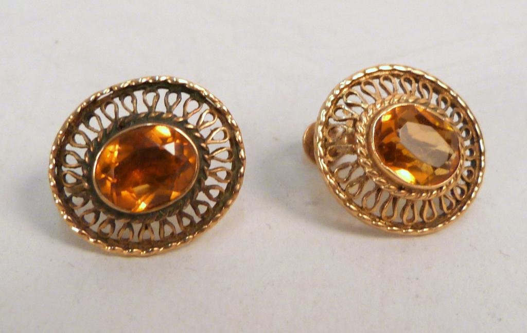 Pair of 14K Gold Earrings: Amber colored cut stone. (Estate of Dr. David Becker)
