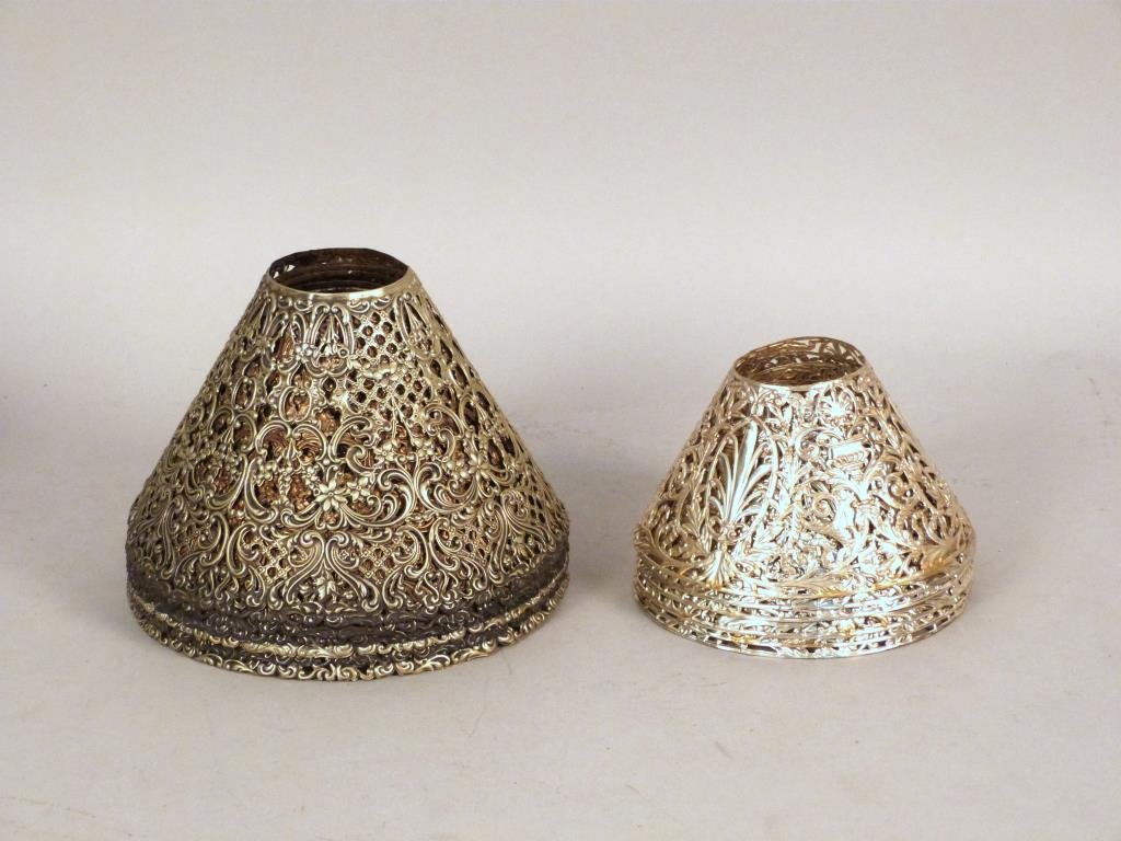 Set of 13 Gorham Sterling Lamp Shades: Two patterns, 7 at 7 D, 6 at 5" D, 23 1/2 troy oz."