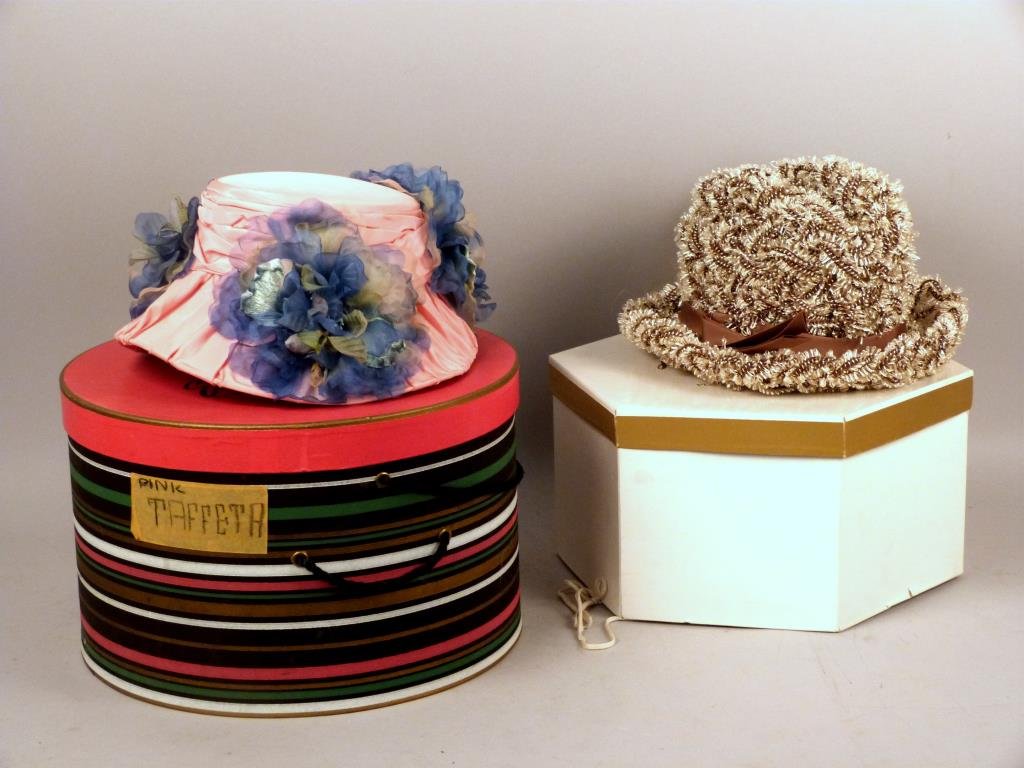 Schiaparelli Straw Hat: Brown and tan artificial straw, together with a pink taffeta hat, both in boxes.