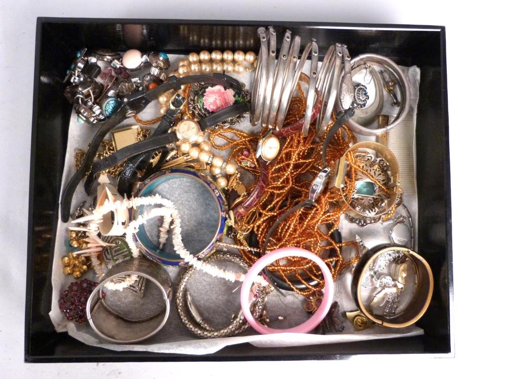 Assorted Lot Costume Jewelry: Bangles, ladies watches including a Gruen gold filled watch.