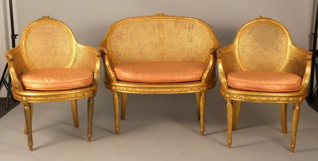 3 Piece Louis XVI Style Parlor Suite: Gilt carved, double cane sides, some caning as-is, settee: 31 W X 20" D 35" H, chairs: 24" W x 18 1/2" D x 35" H."