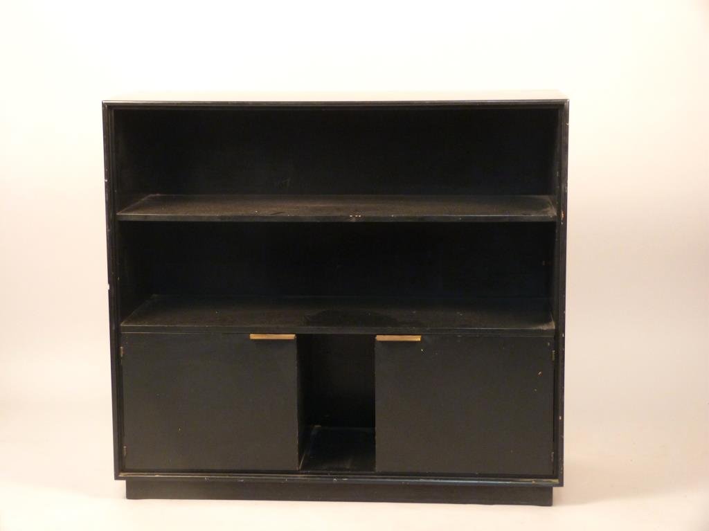 Gilbert Rodhe for Herman Miller Ebonized Shelf: Two open shelves over two doors, with brass hardware, 40 W x 16" D x 36" H."