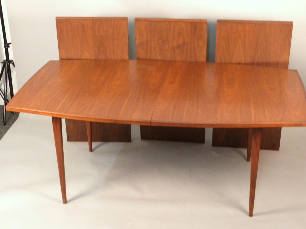 Danish Modern Dining Table: Cross banded and line inlaid top with sculpted edges, likely by Neils Moller, closed: 74 L x 42" W x 29" H, with three leaves, each 21" wide."