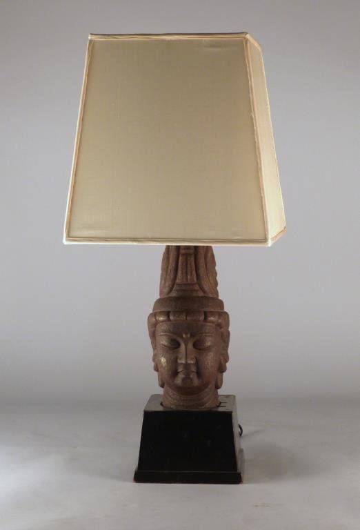 James Mont Style Table Lamp: With composite bust of a bodhisattva, on ebonized base, 7 1/2 W x 7 1/2" D x 30"H."
