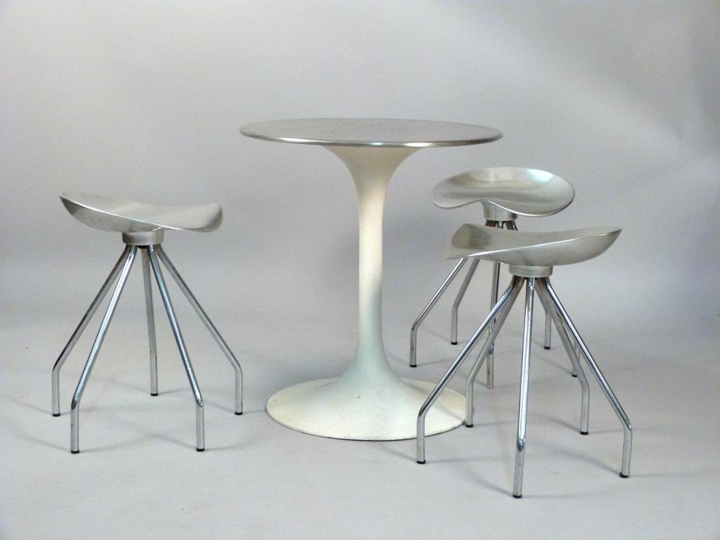 Three Pepe Cortés Jamaica Aluminum Stools: Together with a Saarinen style table base with aluminum top, stools: 14 1/4 W x 13 1/4" D x 20 1/4" H, table: 22 1/2" D x 25" H."