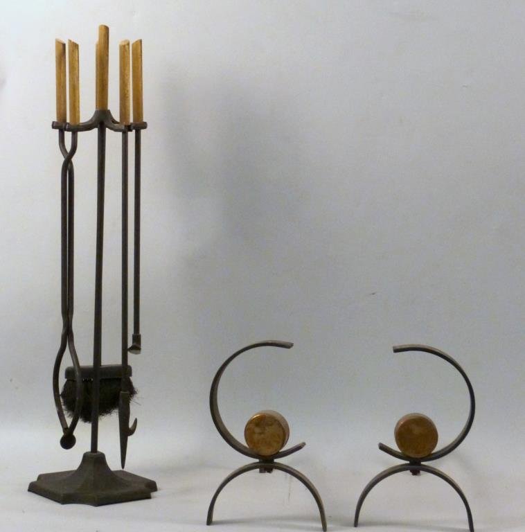 Modernist Style Fire Place Set: Wrought iron and brass tone, andirons and 3 tools on stand, andirons: 8 W x 17" D x 12 1/2" H, tool stand 33 1/2" H."