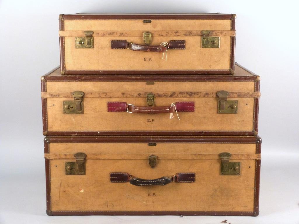 Three Hartmann Skymate Luggage Pieces: Canvas and leather wrapped, slightly stained interiors, 32 W x 20" D x 12" H; 32" W " x 20" D x 9" H; 26" W x 18" D x 9" H."