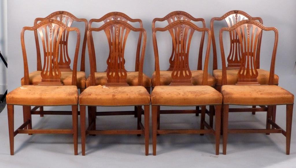 Set of Eight Hepplewhite Style Dining Side Chairs: With distressed and as-is leather upholstery, one chair back with loss, H" stretchers, Slight Scoop form seats. 21" W x18" D x 37" H."