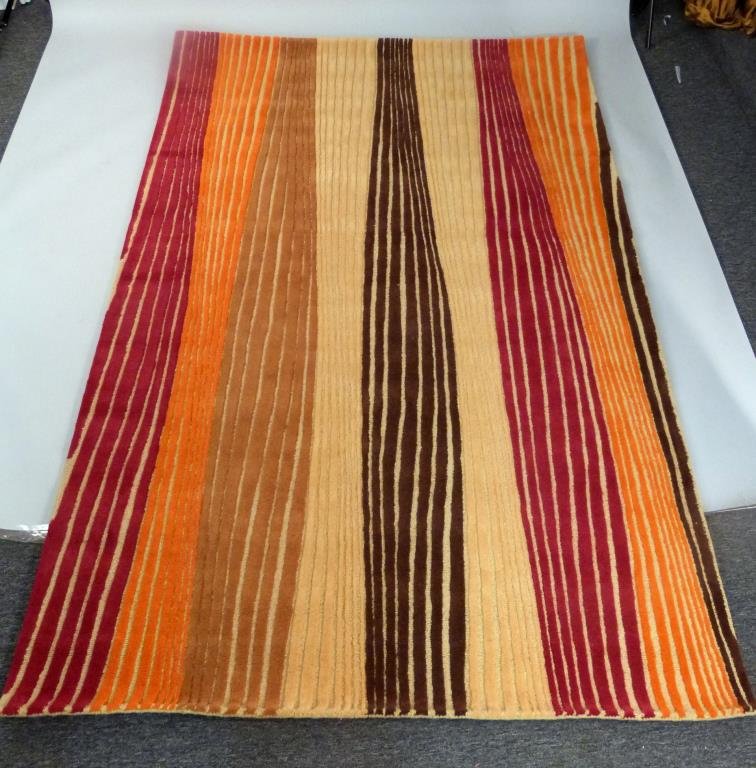 David Shaw Nicholls Pile Rug 6' x 9': Riley Rhythm Saffron' pattern. Red, orange, brown, tan, red.