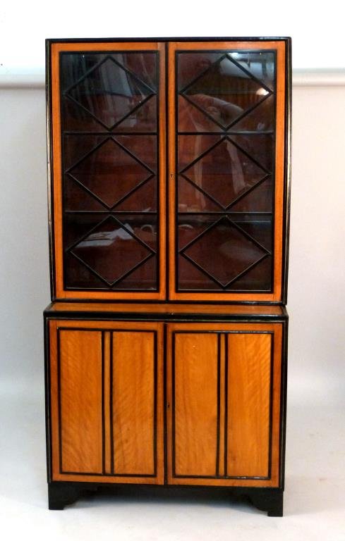 Biedermeier Cabinet: Cherry wood with ebonized trim with brass line inlay, glass doors opening to wood shelves, over wood doors opening to shelves (shelves missing), 40 3/4" W x 18 3/4" D x 80 1/2" H.