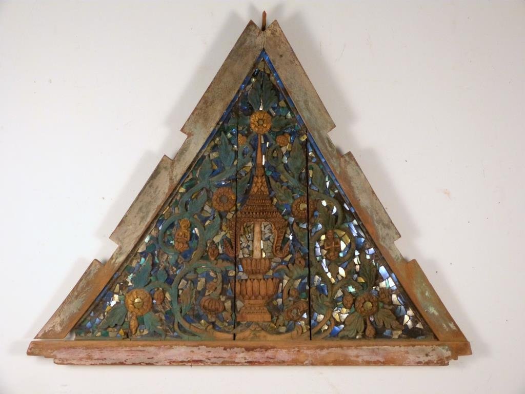 Indonesian Carved Triangular Panel: Painted and gilt with mosaic mirror inlay, 53" W x 43" T x 3" D.