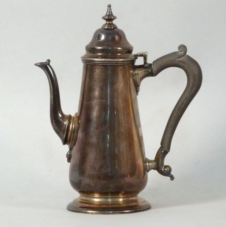 Antique English Silver Teapot: William Gibson & John Langman, 1896, with wooden handle, the bottom stamped Goldsmith & Silversmiths Company 112 Regent St W, the body and lid both hallmarked, 9" H, 13.5 troy oz inclusive.