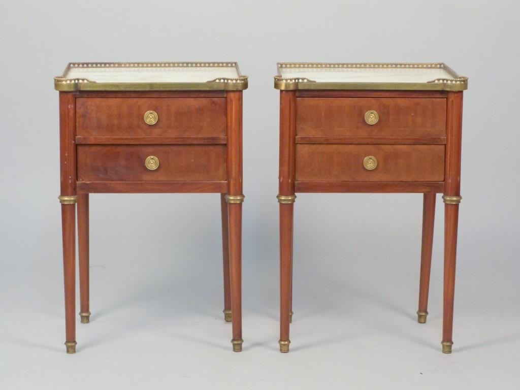 Pair of Signed French End Tables *****: With 3/4 beaded/gadroon rim gallery over inset marble tops, two drawers each, having the Maison Jansen Stamp on the underside of each top drawer, on tapered legs with brass appointments, 17" W x 13" D