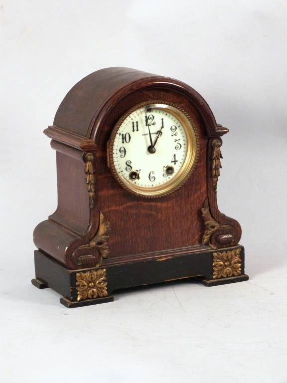 Seth Thomas Oak Mantel Clock: Enameled dial, carved wood, gilt carved and metal mounts. 9.25"W x 4.75"D x 10.5"H